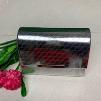 Gold box-shaped sling bag.